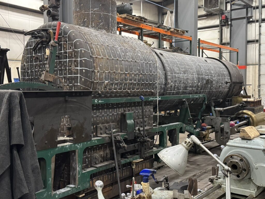 A steam locomotive boiler in the middle of repairs